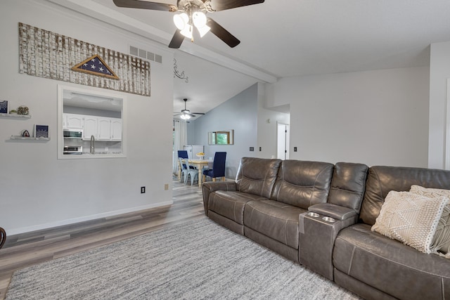 109 N Linnwood Dr, Linn, MO 65051 - living area featuring a ceiling fan, wood finished floors, and baseboards