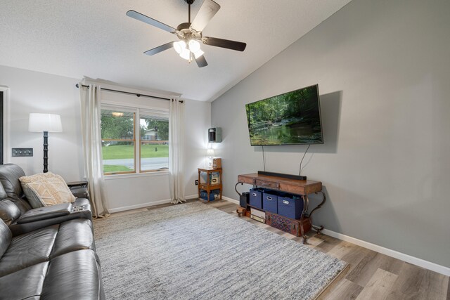 109 N Linnwood Dr, Linn, MO 65051 - living room featuring lofted ceiling, ceiling fan, wood finished floors, and baseboards
