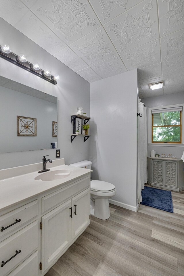 109 N Linnwood Dr, Linn, MO 65051 - bathroom with vanity, toilet, wood finished floors, and curtained shower