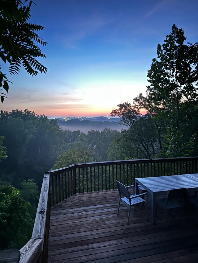 2416 Cimarron Dr, Columbia, MO 65203 - deck at dusk featuring outdoor dining area