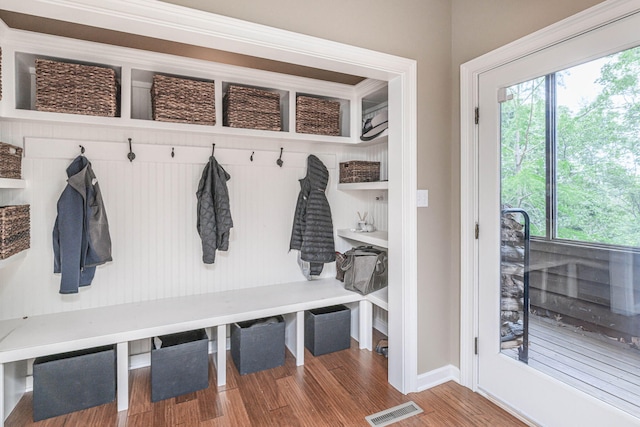 2416 Cimarron Dr, Columbia, MO 65203 - mudroom with healthy amount of natural light, wood finished floors, and baseboards