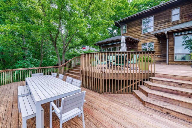 2416 Cimarron Dr, Columbia, MO 65203 - wooden deck with outdoor dining area and stairway