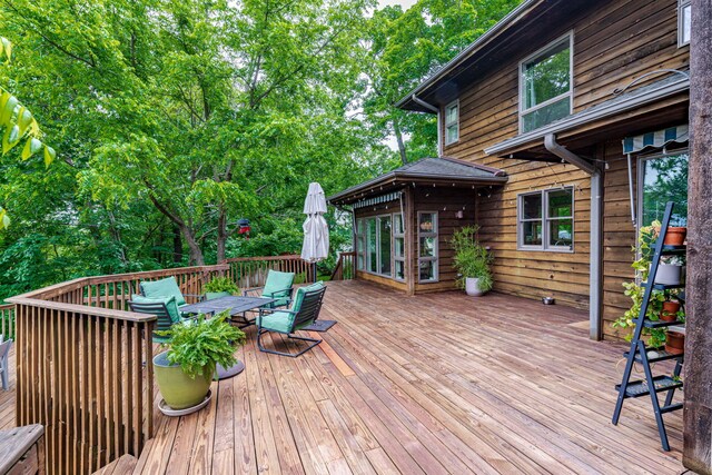 2416 Cimarron Dr, Columbia, MO 65203 - deck featuring outdoor dining space and view of scattered trees