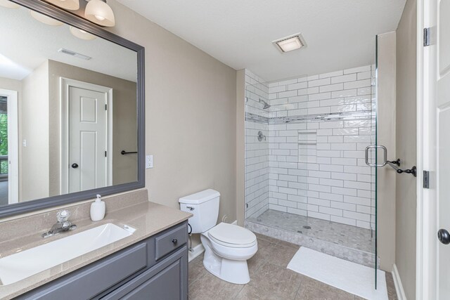 2416 Cimarron Dr, Columbia, MO 65203 - bathroom with toilet, a shower stall, vanity, tile patterned flooring, and baseboards