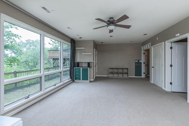 2416 Cimarron Dr, Columbia, MO 65203 - unfurnished living room with a ceiling fan, carpet floors, and baseboards