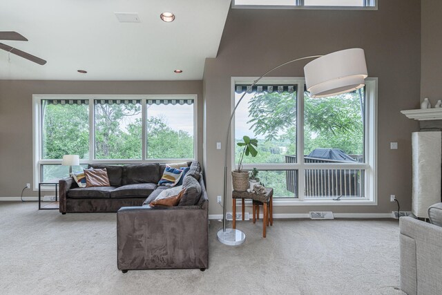 2416 Cimarron Dr, Columbia, MO 65203 - living area with carpet floors, a ceiling fan, and plenty of natural light