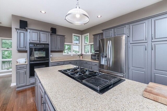 2416 Cimarron Dr, Columbia, MO 65203 - kitchen featuring black appliances, gray cabinetry, recessed lighting, dark wood-type flooring, and hanging light fixtures