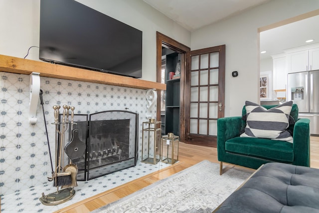 303 S Glenwood Ave, Columbia, MO 65203 - living area with wood finished floors, recessed lighting, and a tile fireplace