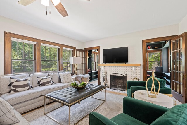 303 S Glenwood Ave, Columbia, MO 65203 - living room featuring a fireplace, a ceiling fan, and wood finished floors