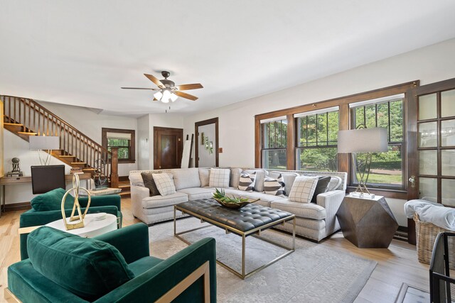 303 S Glenwood Ave, Columbia, MO 65203 - living area with stairs, a ceiling fan, and light wood-style flooring