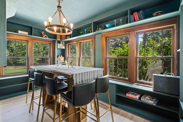 303 S Glenwood Ave, Columbia, MO 65203 - dining space with a chandelier, wood finished floors, and healthy amount of natural light