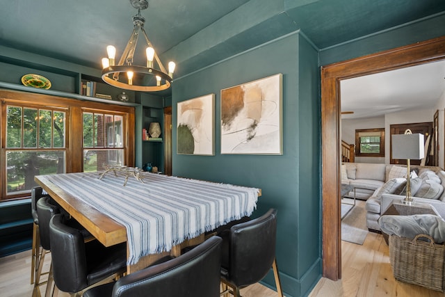 303 S Glenwood Ave, Columbia, MO 65203 - dining space with a chandelier and wood finished floors