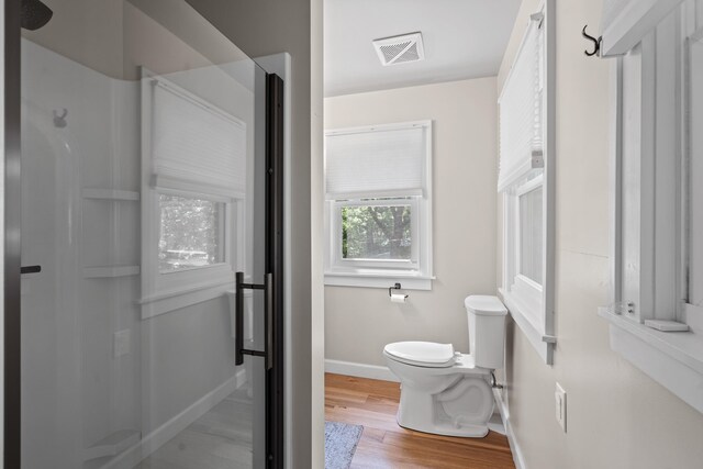 303 S Glenwood Ave, Columbia, MO 65203 - bathroom featuring walk in shower and wood finished floors