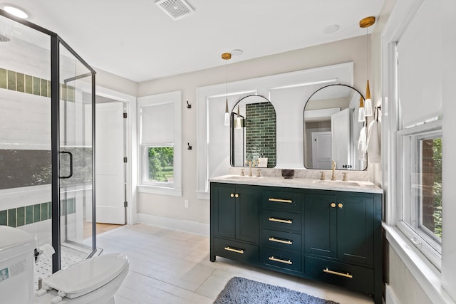 303 S Glenwood Ave, Columbia, MO 65203 - bathroom featuring double vanity and a stall shower