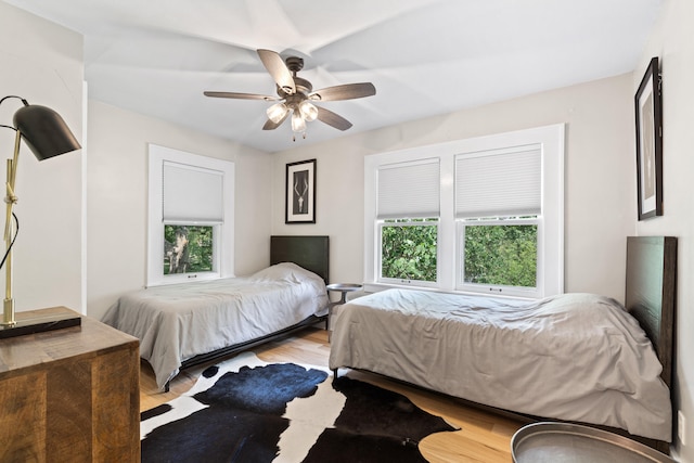 303 S Glenwood Ave, Columbia, MO 65203 - bedroom with light wood-style floors and a ceiling fan