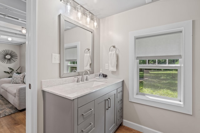 303 S Glenwood Ave, Columbia, MO 65203 - bathroom featuring vanity, ensuite bathroom, and wood finished floors