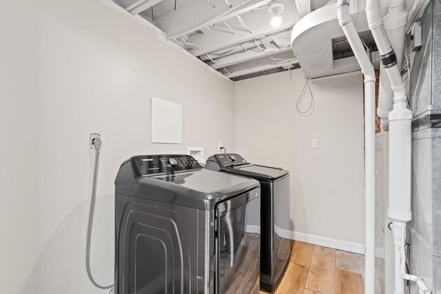 303 S Glenwood Ave, Columbia, MO 65203 - laundry area with washing machine and dryer and wood finished floors