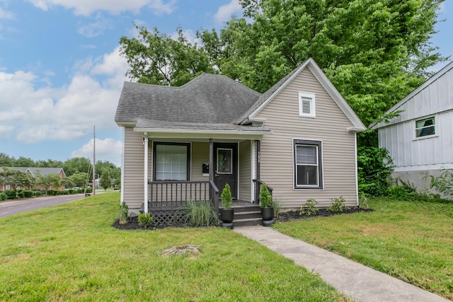 500 W Sexton Rd, Columbia, MO 65203 - view of front of home with covered porch, a front lawn, and a shingled roof