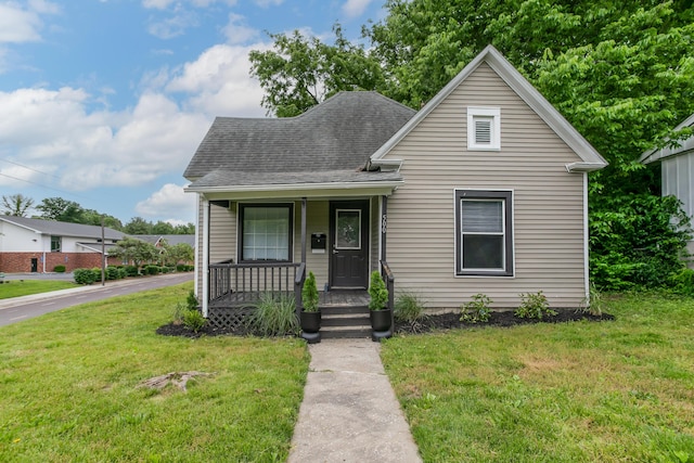 500 W Sexton Rd, Columbia, MO 65203 - view of front of property with a porch, a front lawn, and roof with shingles