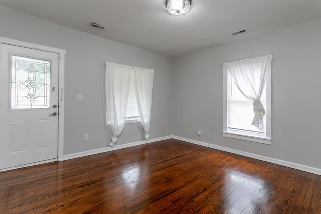 500 W Sexton Rd, Columbia, MO 65203 - foyer with dark wood-type flooring, baseboards, and a textured ceiling