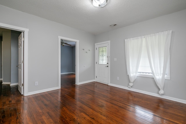 500 W Sexton Rd, Columbia, MO 65203 - unfurnished living room featuring wood finished floors, a textured ceiling, baseboards, and ceiling fan