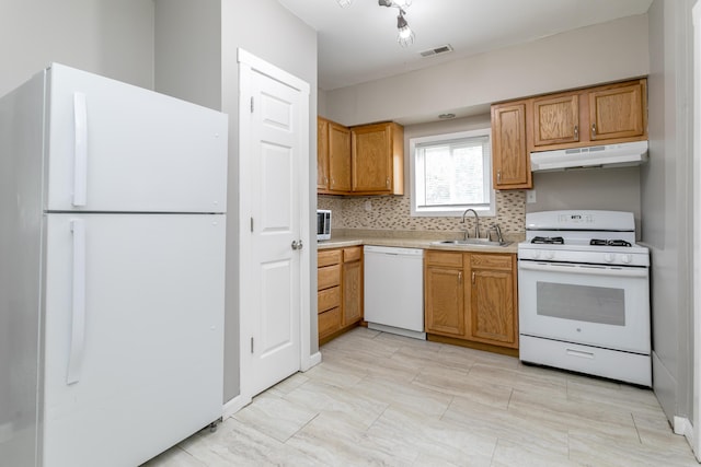 500 W Sexton Rd, Columbia, MO 65203 - kitchen featuring white appliances, a sink, under cabinet range hood, light countertops, and tasteful backsplash