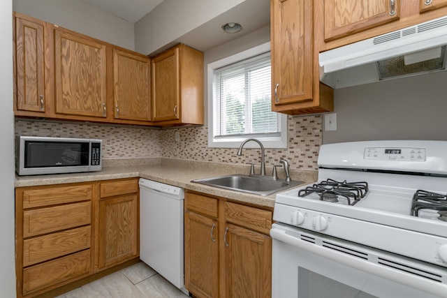 500 W Sexton Rd, Columbia, MO 65203 - kitchen featuring white appliances, a sink, ventilation hood, decorative backsplash, and light countertops