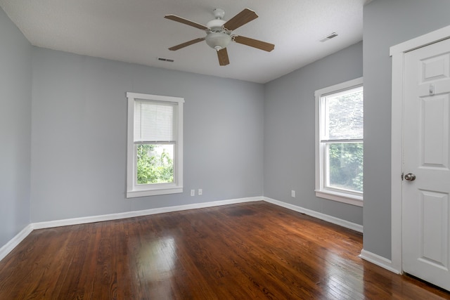 500 W Sexton Rd, Columbia, MO 65203 - empty room with healthy amount of natural light, wood finished floors, and a ceiling fan