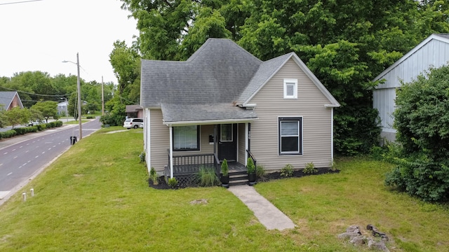 500 W Sexton Rd, Columbia, MO 65203 - view of front of property featuring a porch, a shingled roof, and a front yard