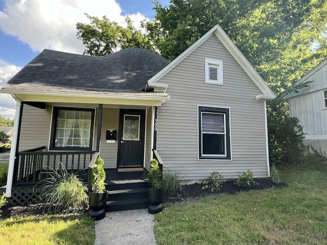 500 W Sexton Rd, Columbia, MO 65203 - view of front of property with a front lawn, covered porch, and a shingled roof