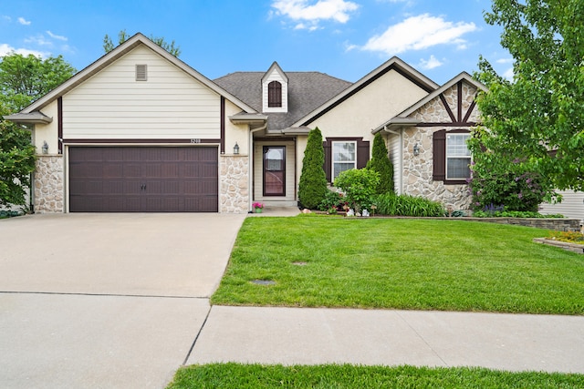 3208 Crabapple Ln, Columbia, MO 65203 - view of front of home with stone siding, an attached garage, and driveway