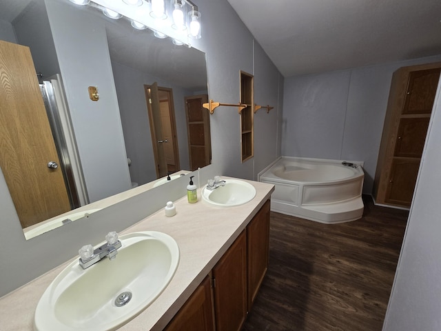 5181 N Jasmine Way, Columbia, MO 65202 - full bath featuring a bath, wood finished floors, and double vanity