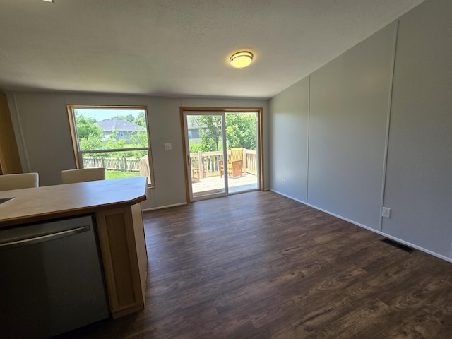 5181 N Jasmine Way, Columbia, MO 65202 - unfurnished living room featuring dark wood-type flooring and vaulted ceiling