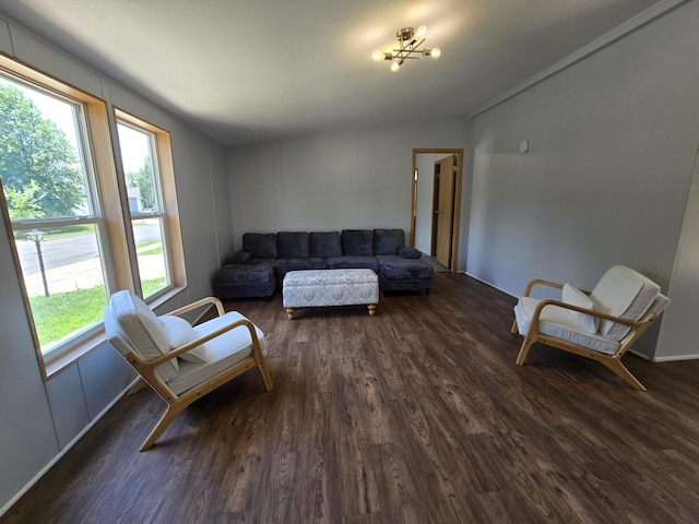 5181 N Jasmine Way, Columbia, MO 65202 - living area featuring lofted ceiling, dark wood-style flooring, and a chandelier