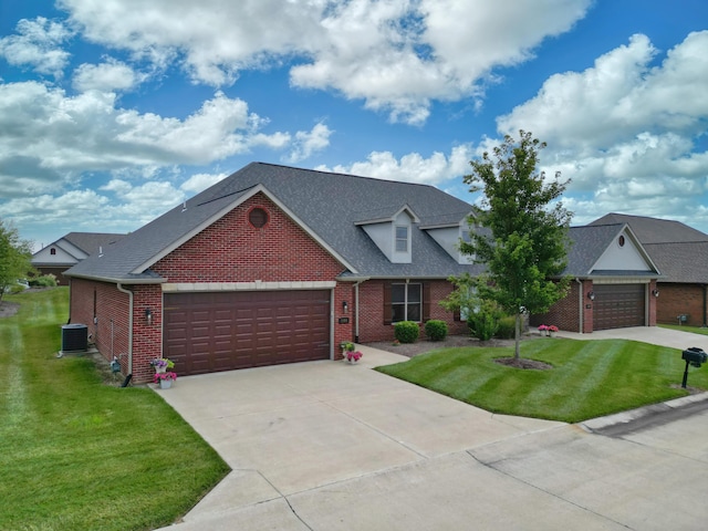 1904 Talco Dr, Columbia, MO 65201 - traditional home with brick siding, a front lawn, an attached garage, and driveway