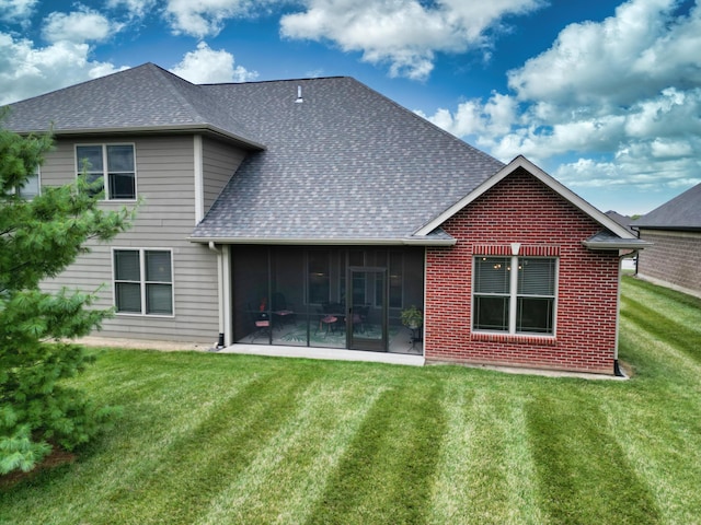 1904 Talco Dr, Columbia, MO 65201 - rear view of property with a shingled roof, a lawn, a sunroom, and brick siding