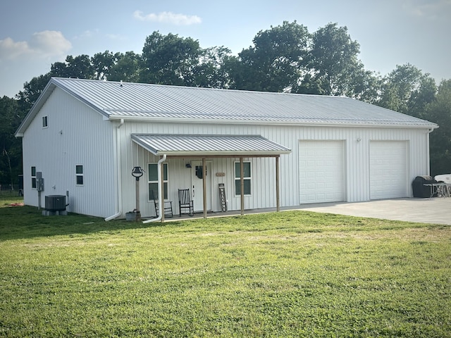 11630 N Varnon School Rd, Hallsville, MO 65255 - view of front facade with central air condition unit, a front yard, covered porch, and metal roof