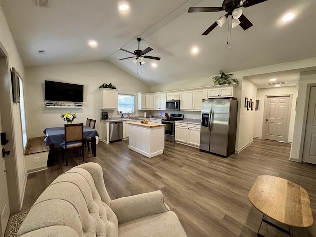 11630 N Varnon School Rd, Hallsville, MO 65255 - kitchen featuring stainless steel appliances, ceiling fan, a sink, a kitchen island, and lofted ceiling