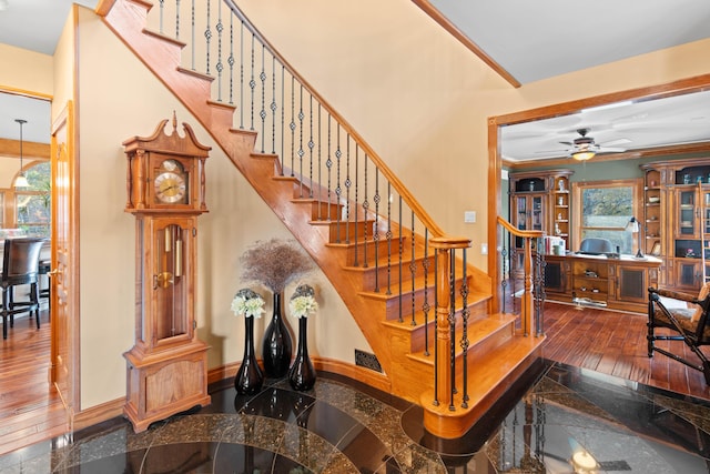 70 E High Point Ln, Columbia, MO 65203 - stairway featuring ceiling fan, baseboards, and hardwood / wood-style flooring