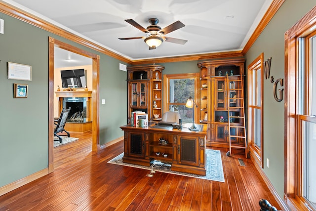 70 E High Point Ln, Columbia, MO 65203 - home office with a fireplace, ceiling fan, ornamental molding, hardwood / wood-style floors, and baseboards
