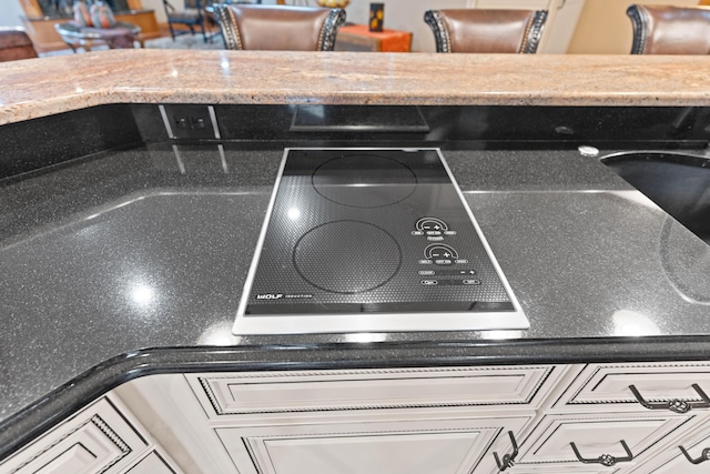 70 E High Point Ln, Columbia, MO 65203 - kitchen view of light stone counters and black electric cooktop