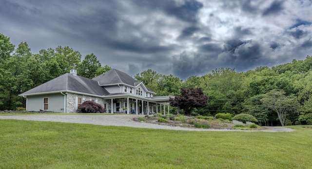 70 E High Point Ln, Columbia, MO 65203 - view of front facade with a front lawn, stone siding, and a chimney
