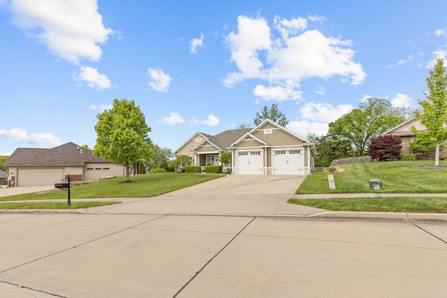 1703 Ballentine Ln, Columbia, MO 65201 - craftsman-style house featuring driveway, a front lawn, and a garage