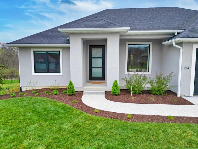 214 Hellwig Ln, Columbia, MO 65203 - view of front of home with roof with shingles and stucco siding
