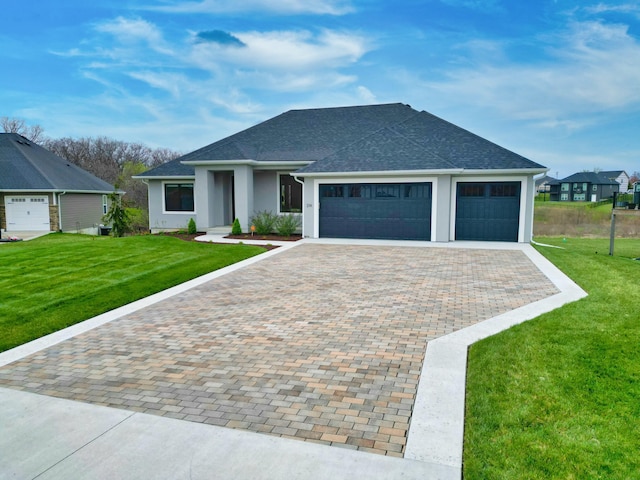 214 Hellwig Ln, Columbia, MO 65203 - view of front of property featuring an attached garage, driveway, a front lawn, and roof with shingles