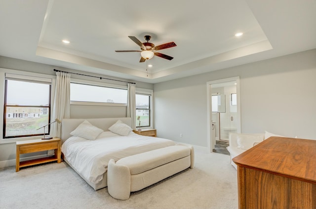 214 Hellwig Ln, Columbia, MO 65203 - bedroom featuring a tray ceiling, light carpet, baseboards, recessed lighting, and ensuite bathroom