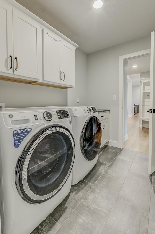 214 Hellwig Ln, Columbia, MO 65203 - washroom with cabinet space, washer and clothes dryer, recessed lighting, baseboards, and light tile patterned floors