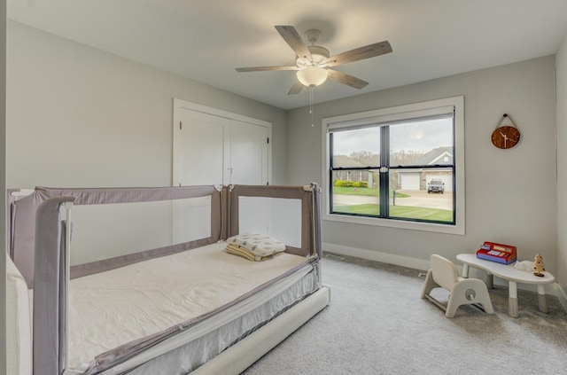 214 Hellwig Ln, Columbia, MO 65203 - bedroom with light colored carpet, baseboards, and a ceiling fan
