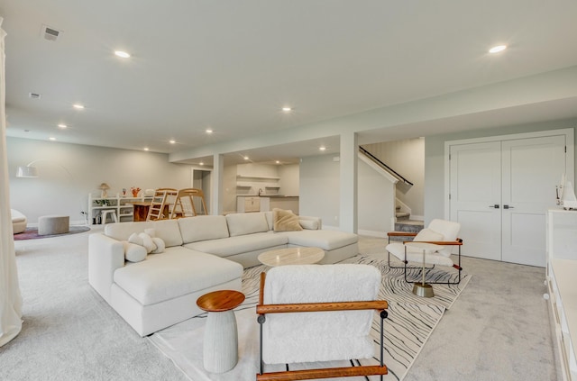 214 Hellwig Ln, Columbia, MO 65203 - living area featuring light carpet, stairs, and recessed lighting