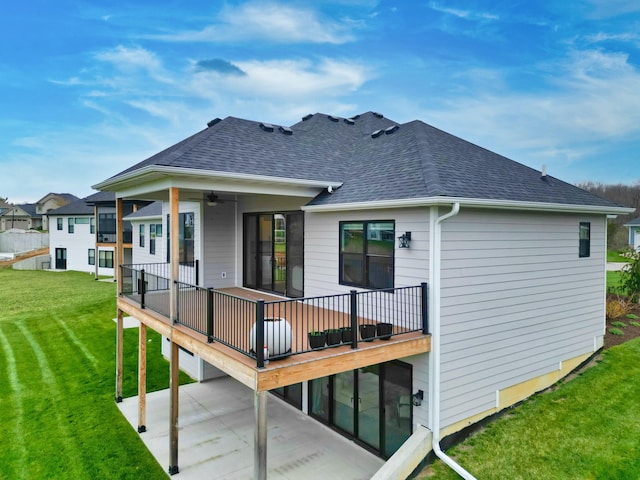 214 Hellwig Ln, Columbia, MO 65203 - rear view of house with roof with shingles, a lawn, a patio area, and a ceiling fan